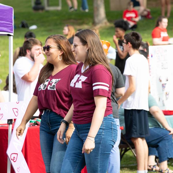 Students walking around an outdoor event